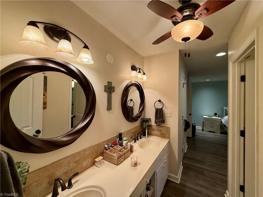 7352 Oak Bucket Road Thomasville, NC 27360 - Photo 14 of 38 Double vanity off the primary for ample space to get ready.