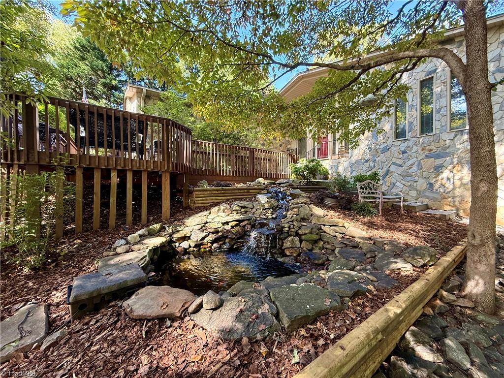 7352 Oak Bucket Road Thomasville, NC 27360 - Photo 36 of 38 Koi pond provides natural ambiance by the front door.