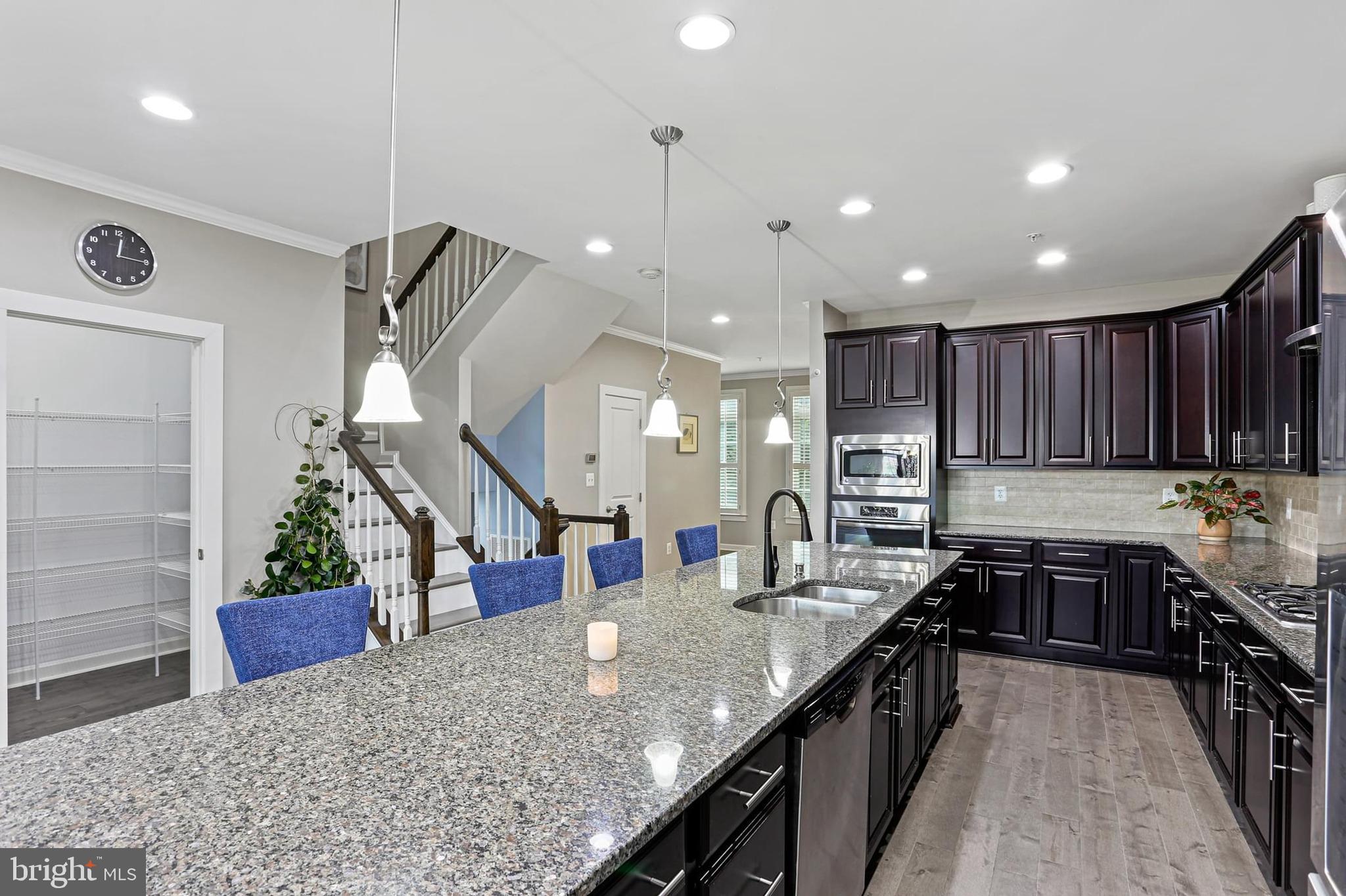 8119 Westside Boulevard Fulton, MD 20759 - Photo 8 of 32 a kitchen with stainless steel appliances granite countertop sink stove top oven and cabinets