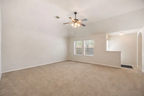 a view of an empty room with a window