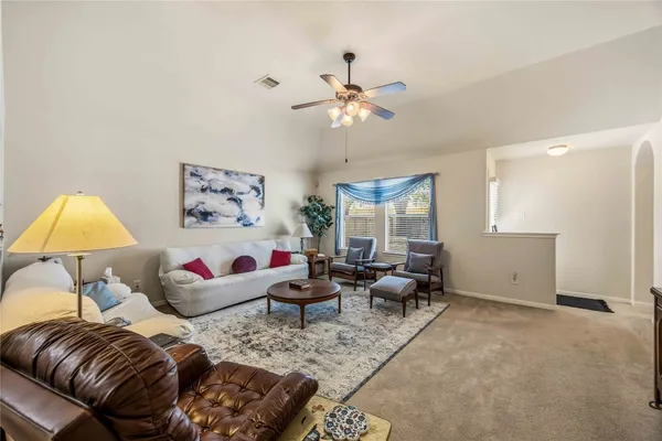 a living room with furniture and a window