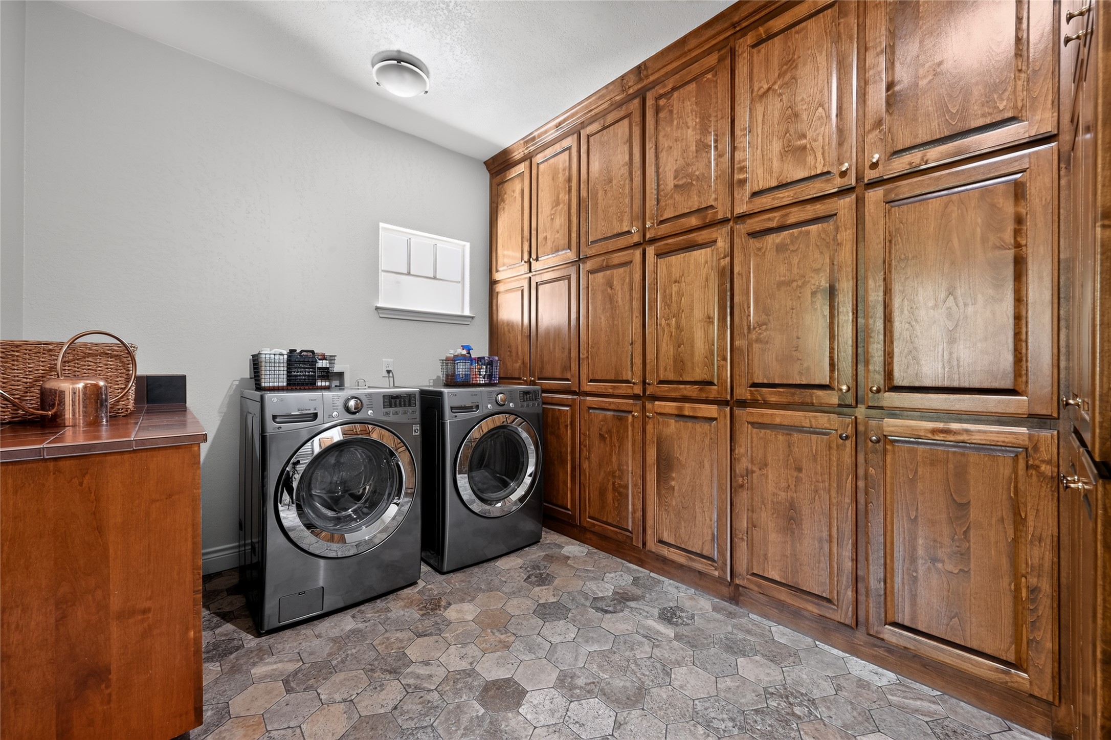 700 Willow Creek Road Salado, TX 76571 - Photo 30 of 39 Huge laundry with lots of pantry storage, updated stone floors