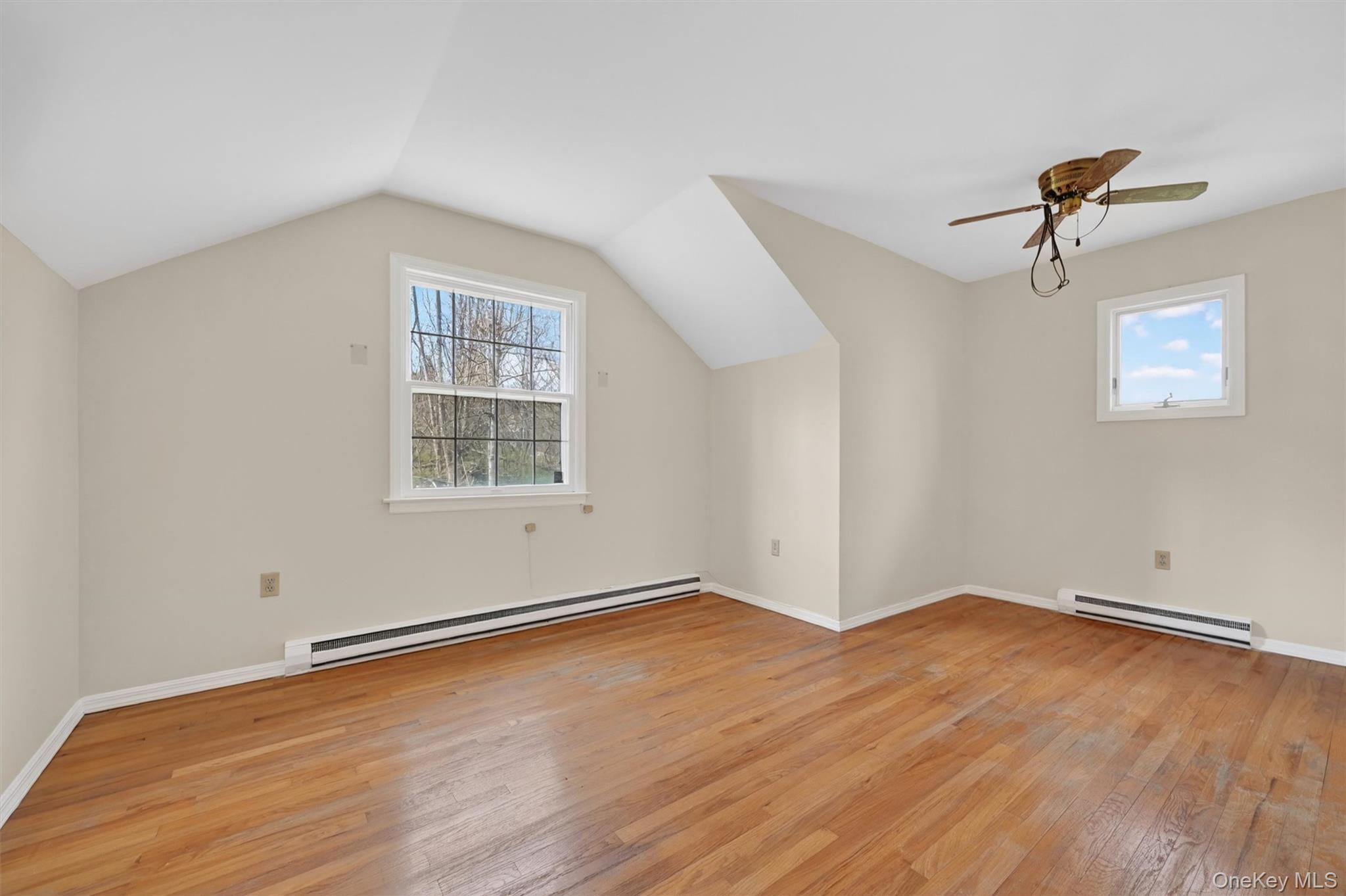 47 Still Road Westtown, NY 10998 - Photo 32 of 49 This bedroom located upstairs features hardwood flooring, white walls, and two windows providing natural light.
