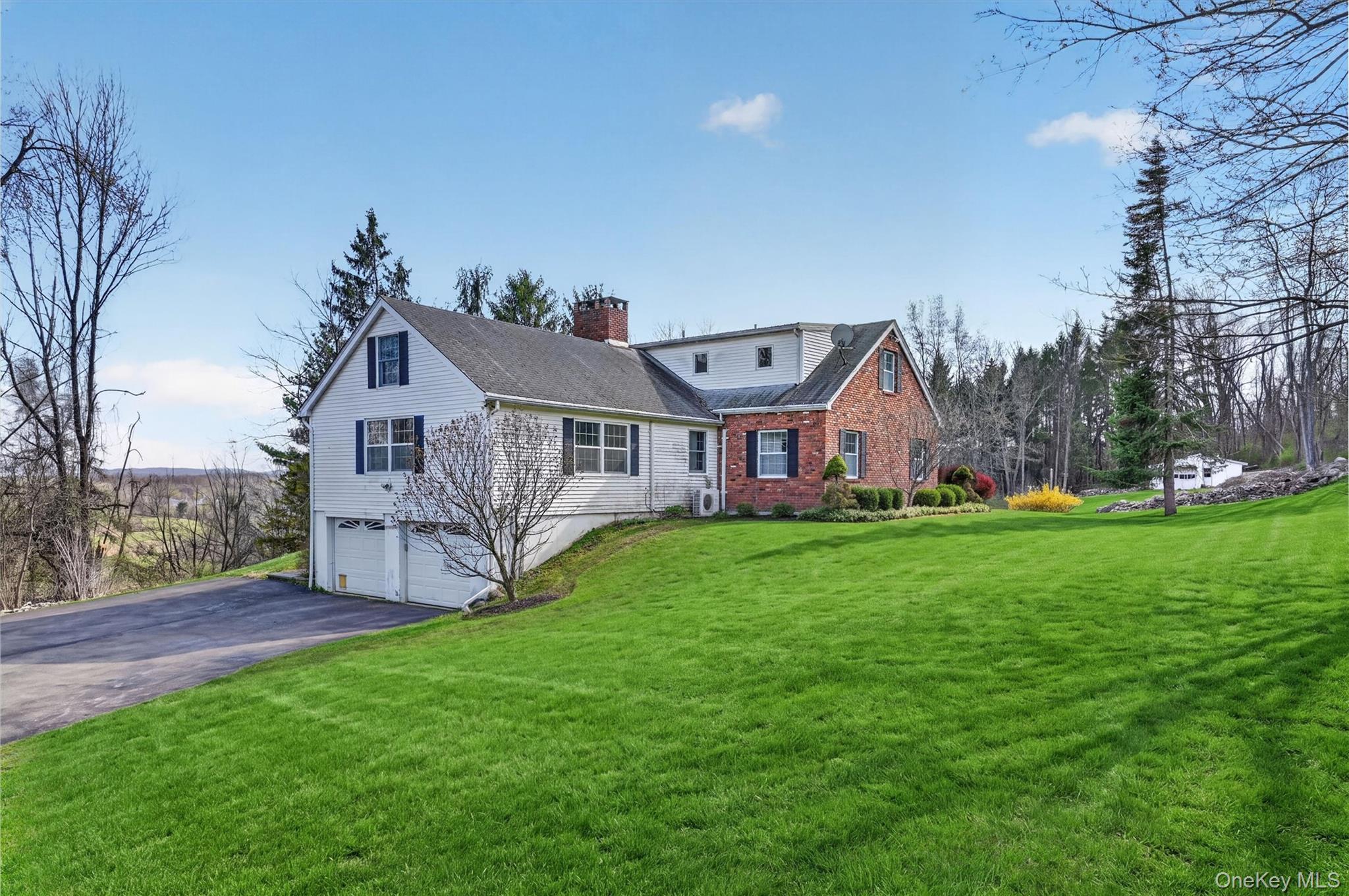47 Still Road Westtown, NY 10998 - Photo 4 of 49 View of the side of the house with 2-car attached garage.