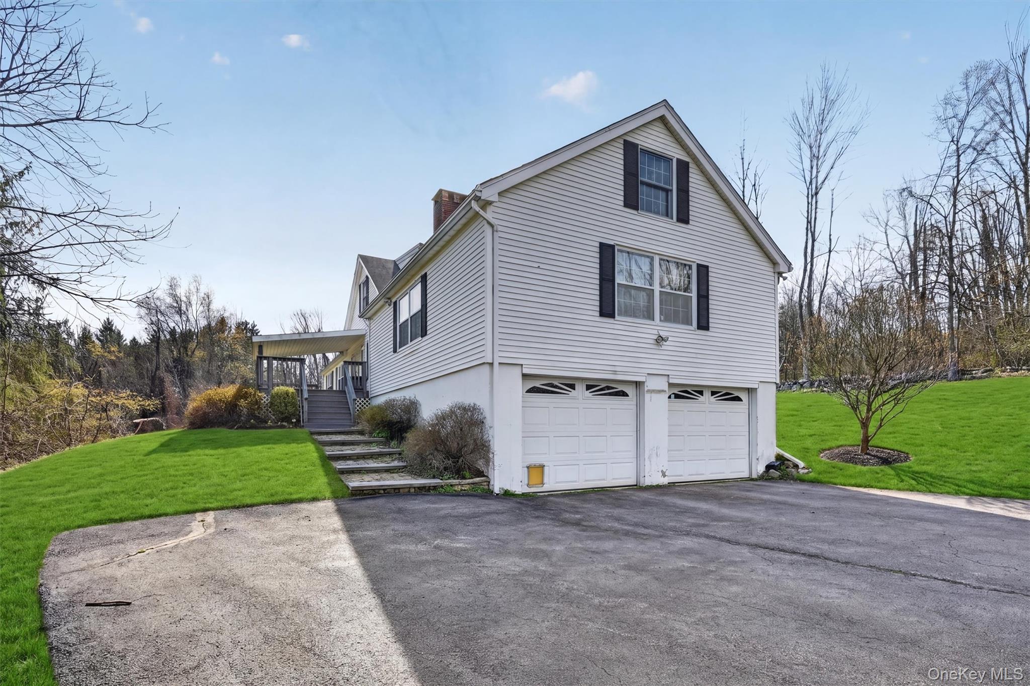 47 Still Road Westtown, NY 10998 - Photo 41 of 49 View of the side of the property featuring an attached 2-car garage.