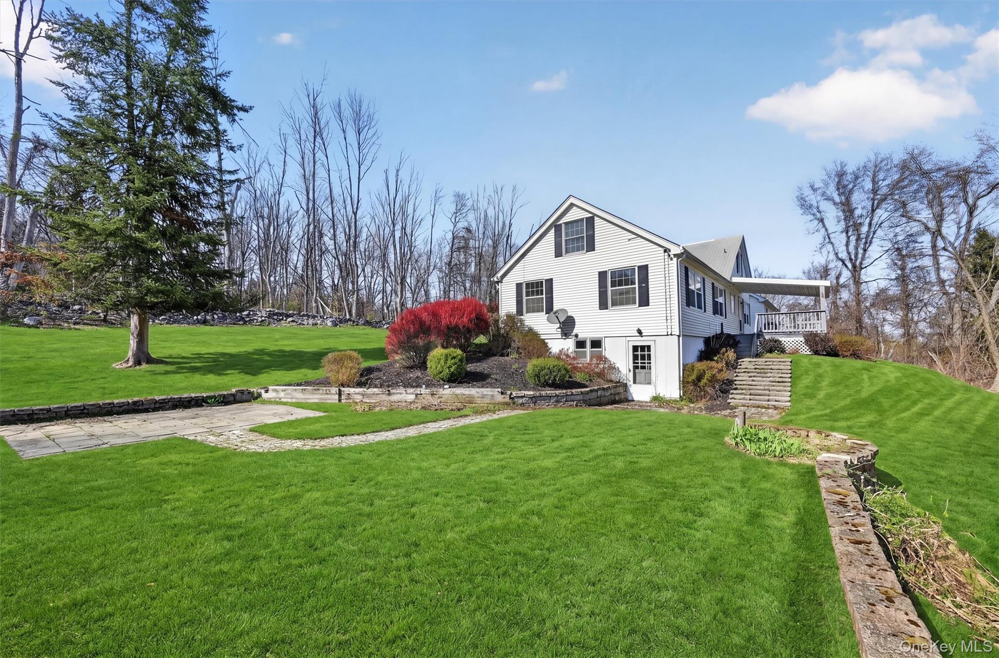 47 Still Road Westtown, NY 10998 - Photo 42 of 49 This property features a well-maintained lawn and mature trees.