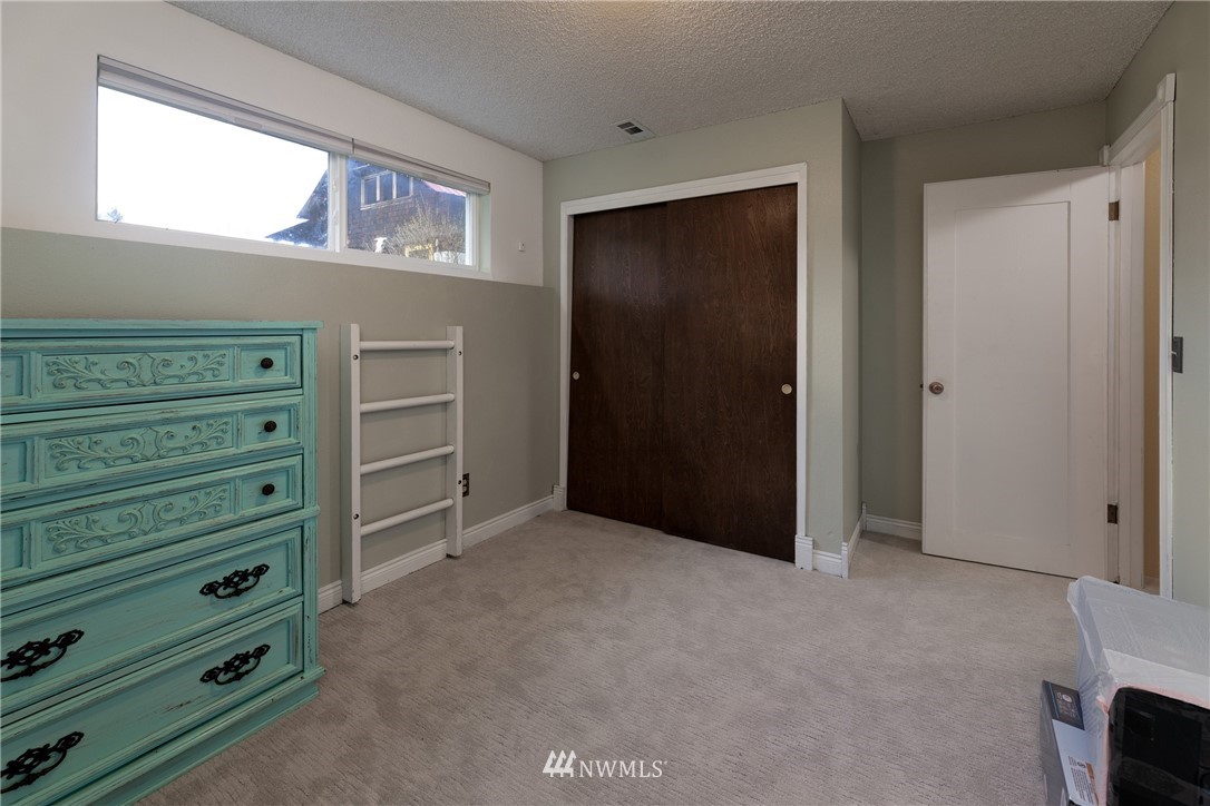 12020 Moen Road Granite Falls, WA 98252 - Photo 14 of 27 a view of an empty room with window and cabinet