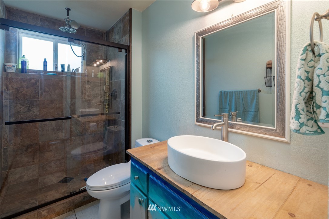 12020 Moen Road Granite Falls, WA 98252 - Photo 15 of 27 a bathroom with a sink toilet and shower