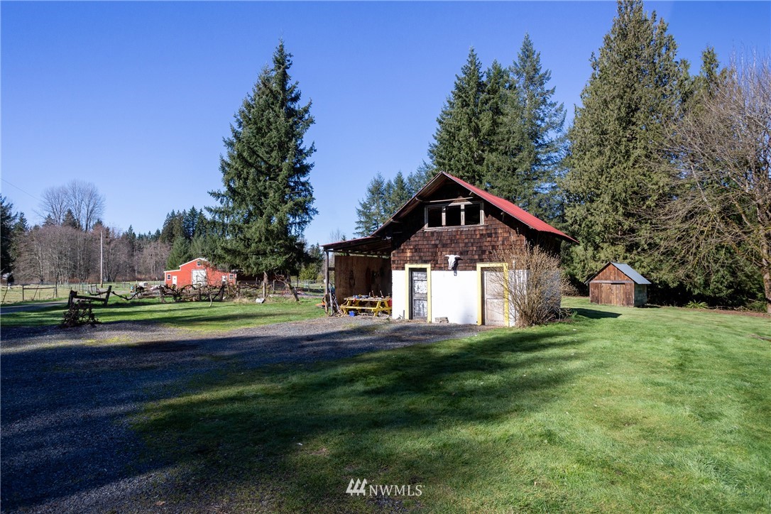 12020 Moen Road Granite Falls, WA 98252 - Photo 20 of 27 a front view of a house with a yard and trees