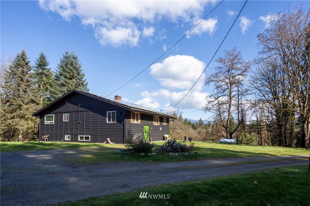 12020 Moen Road Granite Falls, WA 98252 - Photo 4 of 27 a front view of house with yard and green space