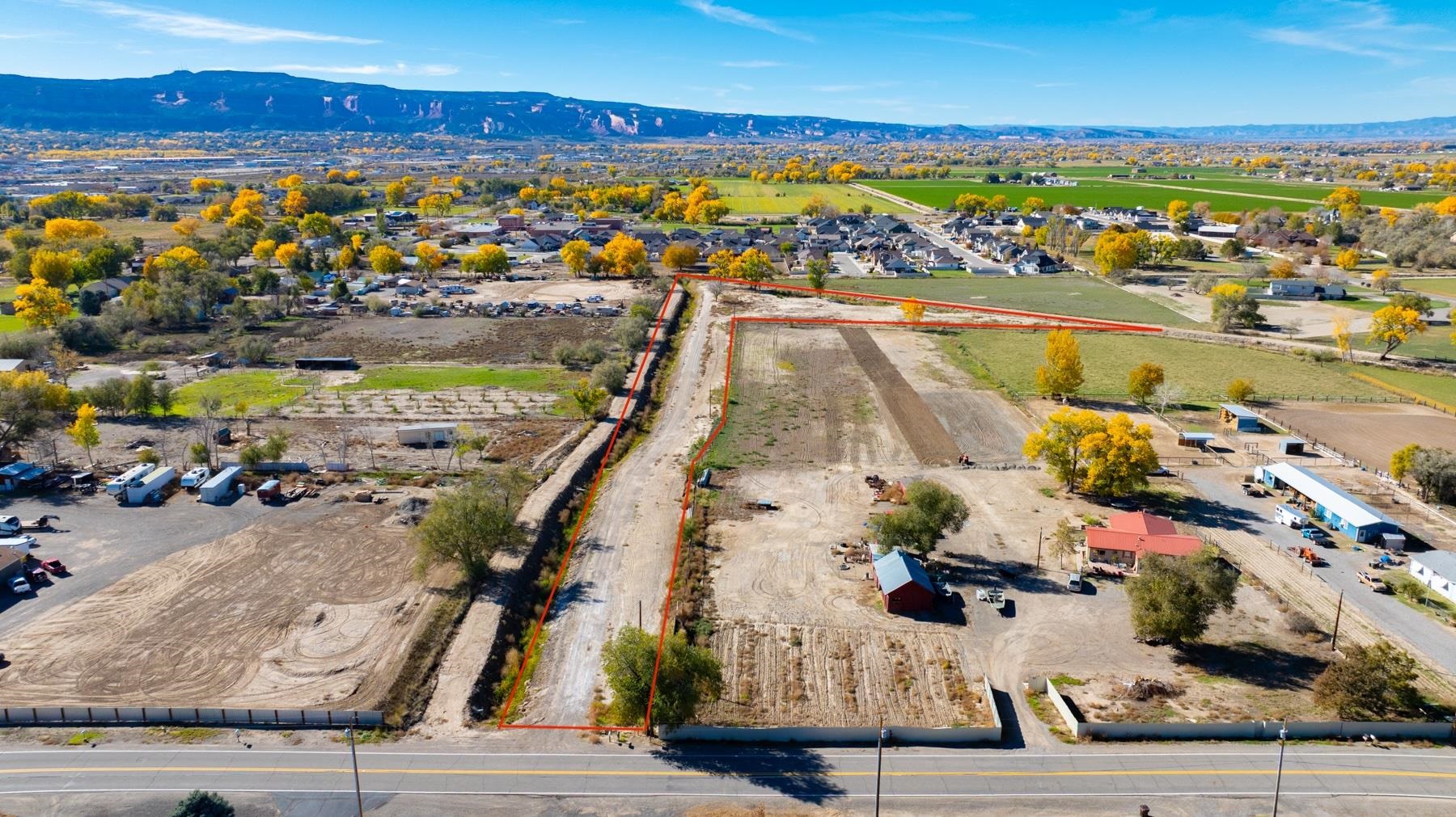 811 24 Road Grand Junction, CO 81505 - Photo 2 of 17 an aerial view of residential houses with outdoor space