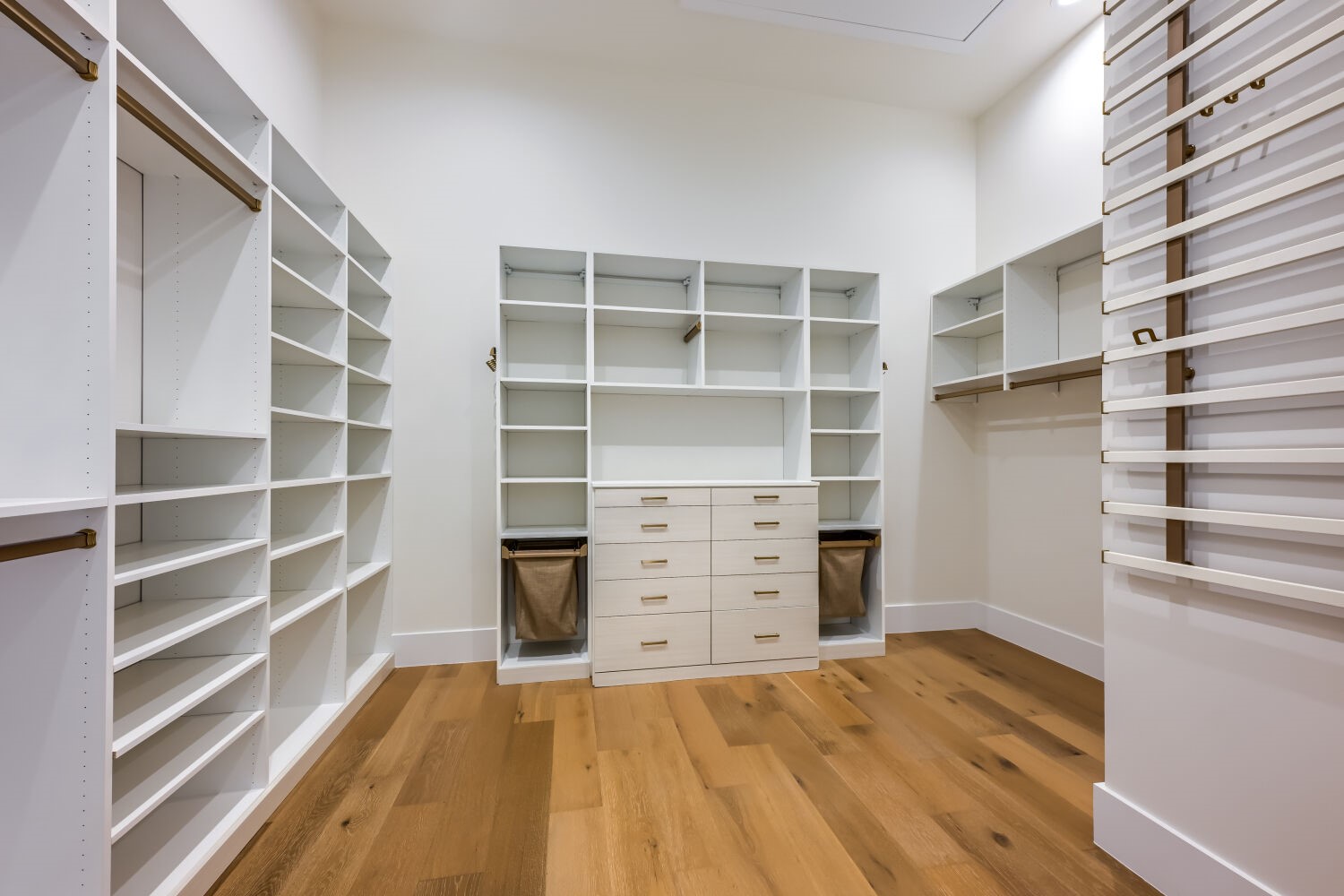 8132 Magnolia Ridge Cove Austin, TX 78738 - Photo 27 of 38 Ample shelving and hanging space defines this generously proportioned dressing area.