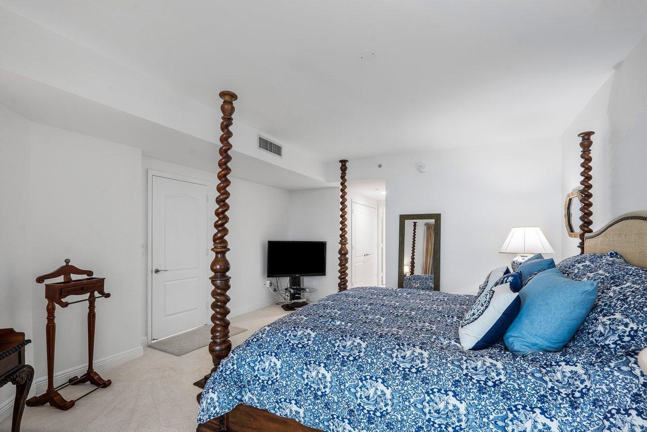 550 Southeast Mizner Boulevard, Unit B706 Boca Raton, FL 33432 - Photo 12 of 64 a bedroom with a bed and a flat screen tv