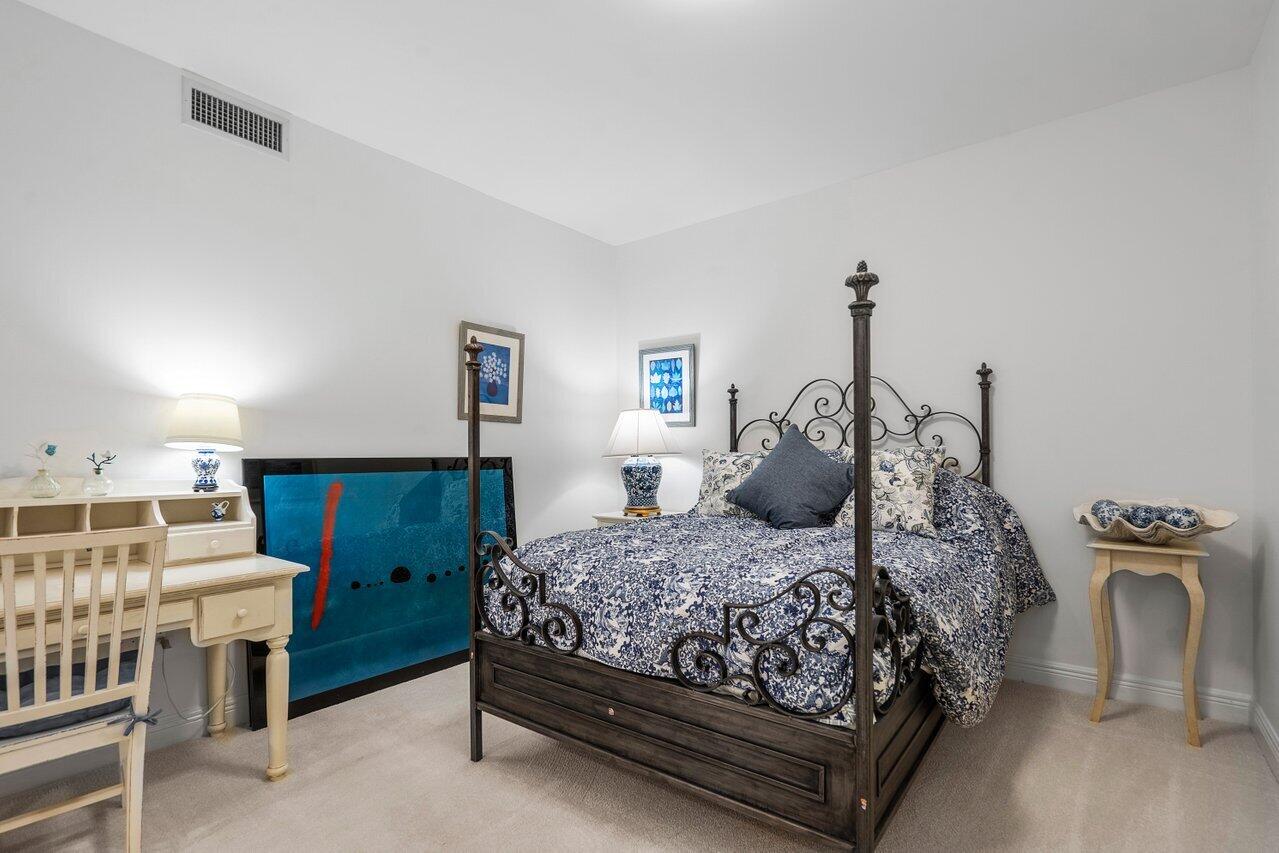 550 Southeast Mizner Boulevard, Unit B706 Boca Raton, FL 33432 - Photo 14 of 64 a bedroom with a bed and wooden floor