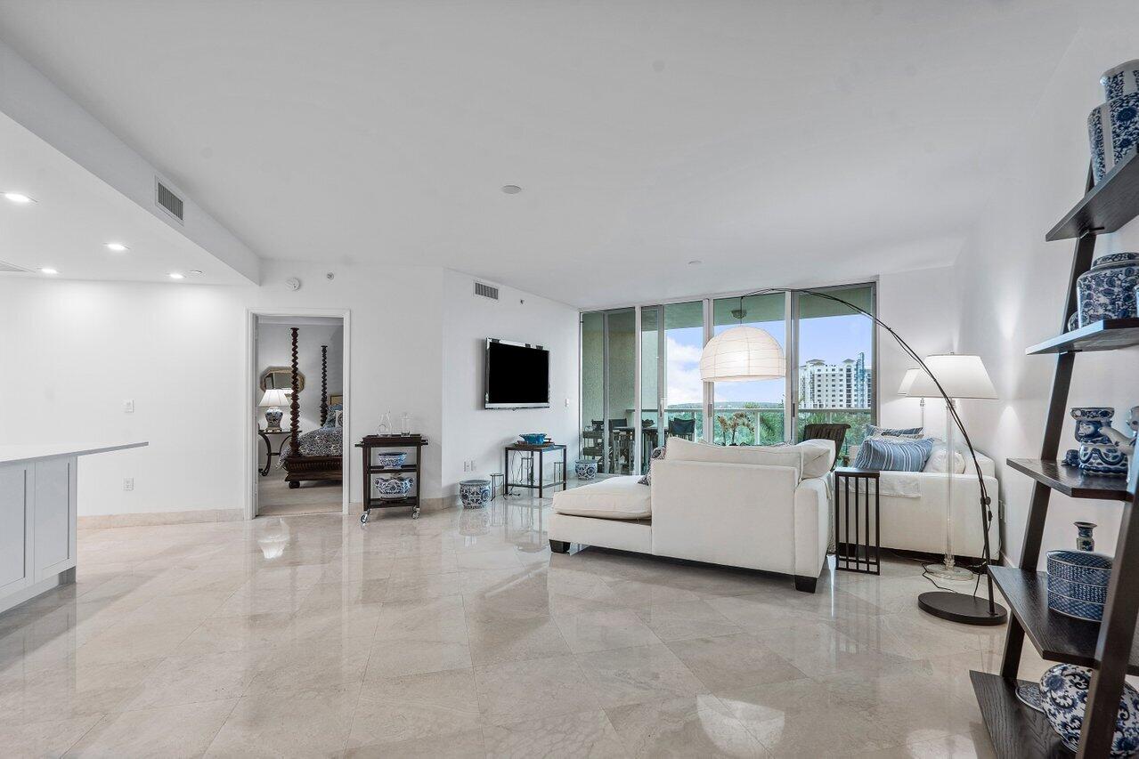 550 Southeast Mizner Boulevard, Unit B706 Boca Raton, FL 33432 - Photo 2 of 64 a living room with furniture and a flat screen tv