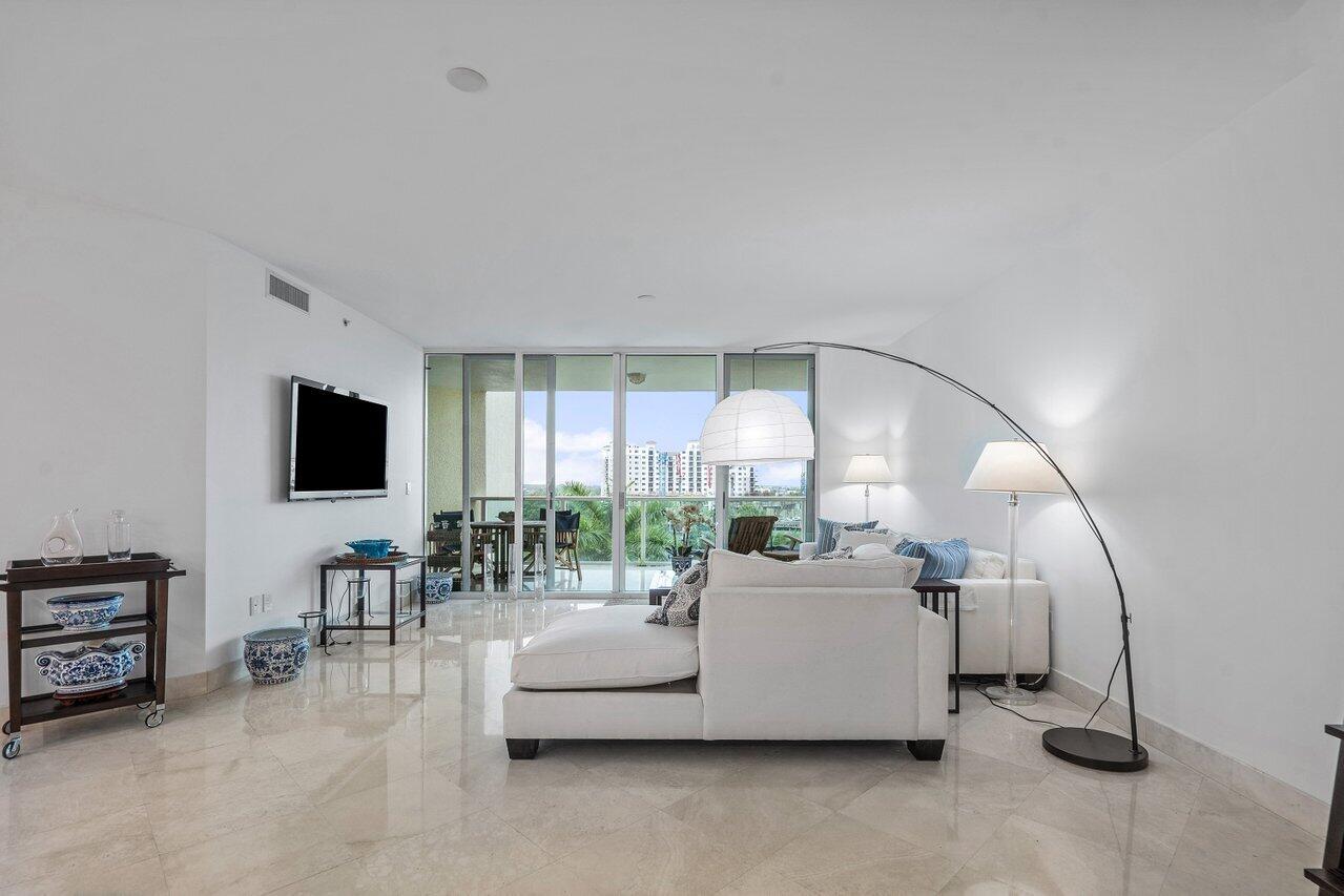 550 Southeast Mizner Boulevard, Unit B706 Boca Raton, FL 33432 - Photo 3 of 64 a living room with furniture and a flat screen tv