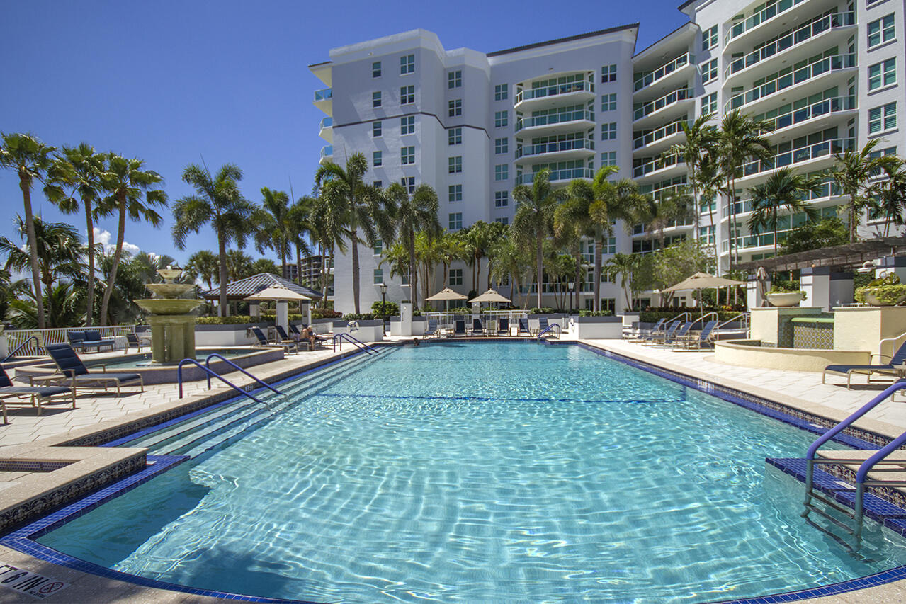 550 Southeast Mizner Boulevard, Unit B706 Boca Raton, FL 33432 - Photo 36 of 64 a swimming pool with outdoor seating and a garden