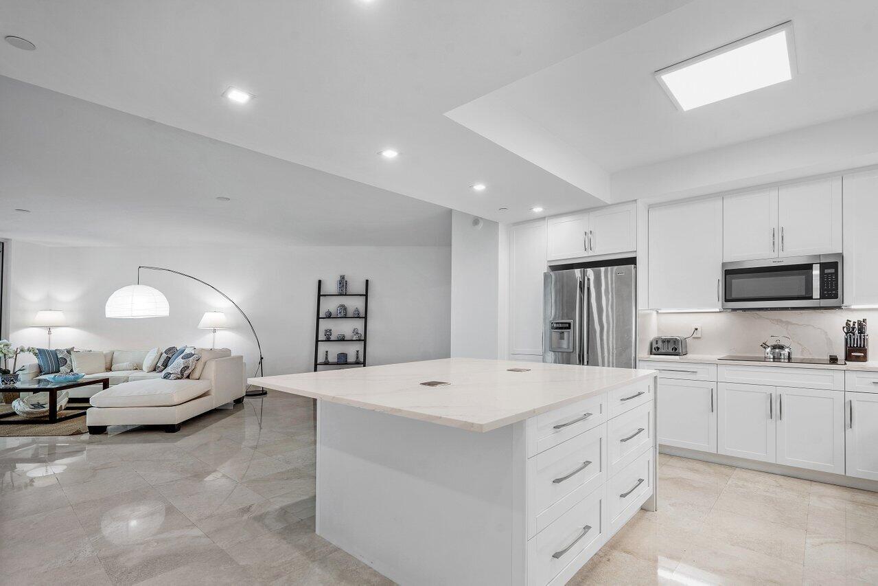 550 Southeast Mizner Boulevard, Unit B706 Boca Raton, FL 33432 - Photo 7 of 64 a large white room with a large window and a couch