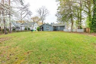 408 Ortega Road Raleigh, NC 27609 - Photo 19 of 25 a front view of a house with a yard