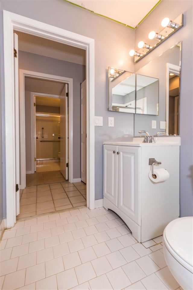 15 Catalonia Court St. Augustine, FL 32086 - Photo 14 of 27 a bathroom with a sink a toilet and mirror