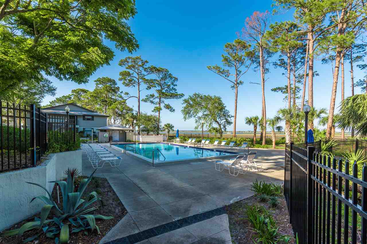15 Catalonia Court St. Augustine, FL 32086 - Photo 18 of 27 a view of a backyard with palm trees