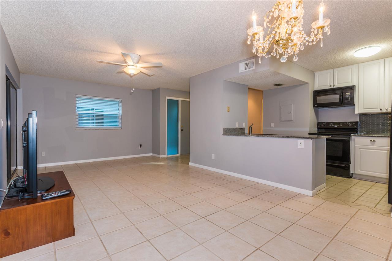 15 Catalonia Court St. Augustine, FL 32086 - Photo 4 of 27 a view of a kitchen with microwave and cabinets