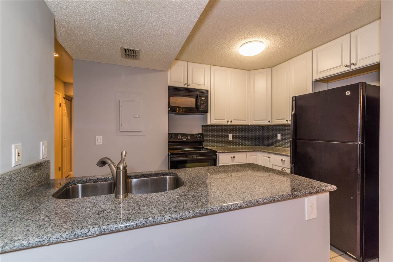 15 Catalonia Court St. Augustine, FL 32086 - Photo 5 of 27 a kitchen with stainless steel appliances granite countertop a refrigerator a stove a sink and a granite counter tops
