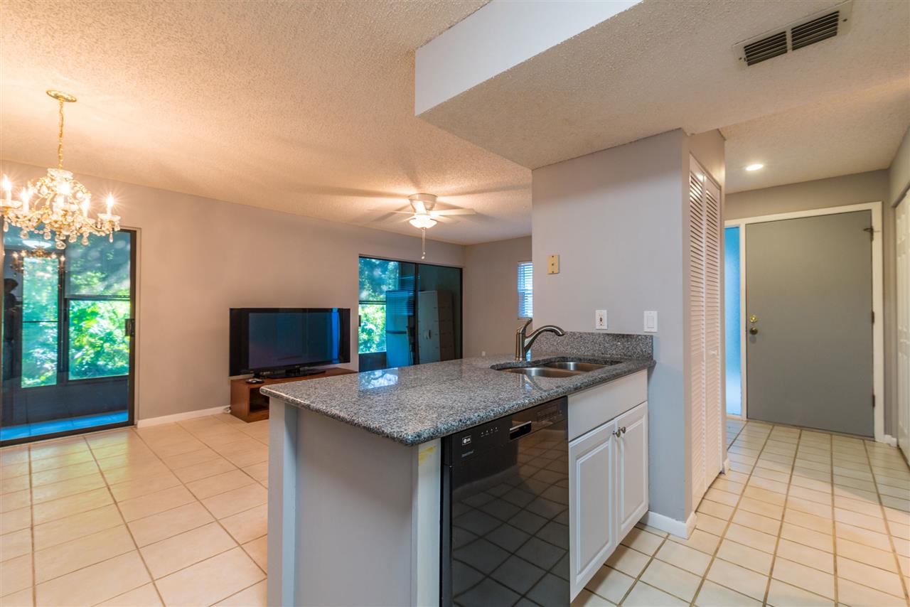 15 Catalonia Court St. Augustine, FL 32086 - Photo 7 of 27 a kitchen with a sink a counter top space and appliances