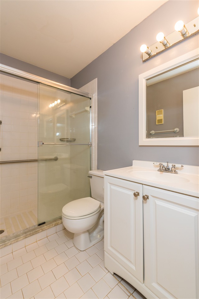 15 Catalonia Court St. Augustine, FL 32086 - Photo 10 of 27 a bathroom with a sink a toilet and shower