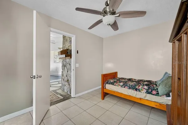 a view of a hallway and a livingroom with furniture