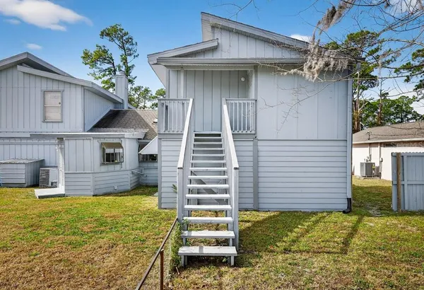 a view of a balcony with chairs