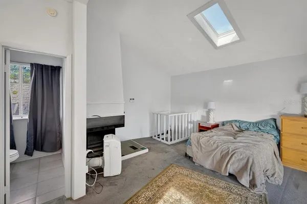 a bathroom with a toilet and a shower curtain