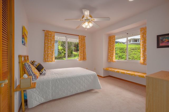 a bed room with a bed and a chandelier