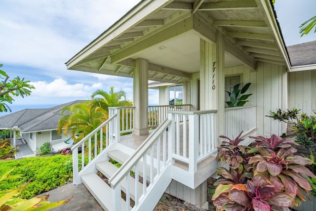 a view of a house with fountain and wooden floor