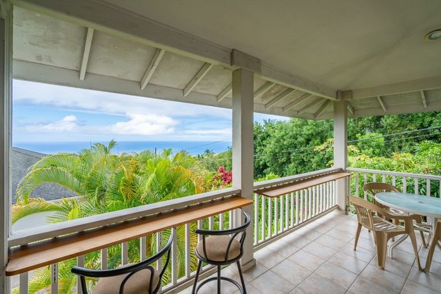 a view of a two chair in the balcony