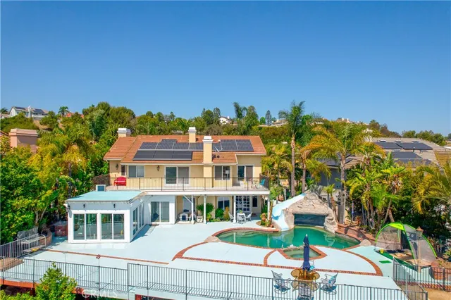 a aerial view of a house with a yard