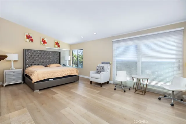 a bedroom with a bed and a fireplace