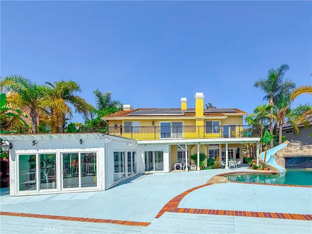 a view of a swimming pool with a lounge chair