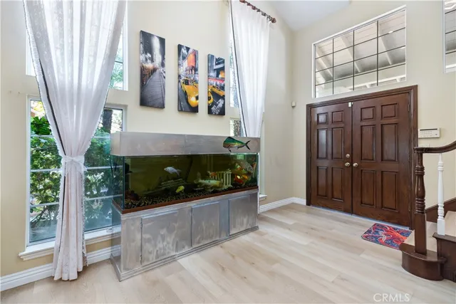 a view of an entryway with wooden floor