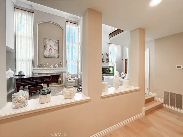 a view of a dining room with furniture and a chandelier