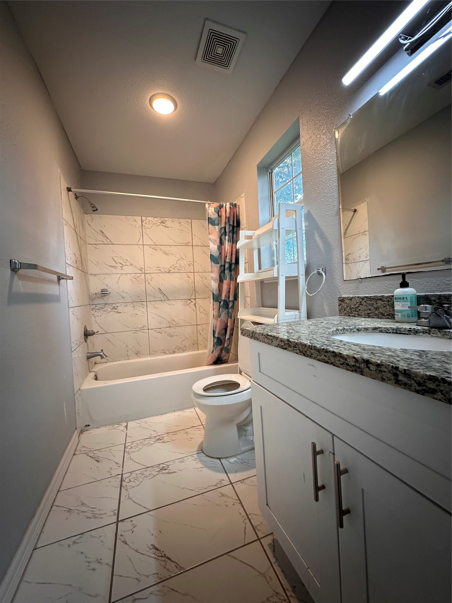 4802 Eppes Street Houston, TX 77021 - Photo 9 of 34 a bathroom with a granite countertop sink a toilet and bathtub