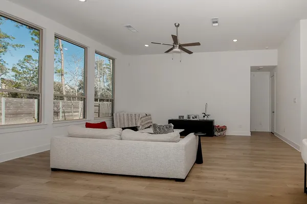 a living room with furniture and a large window