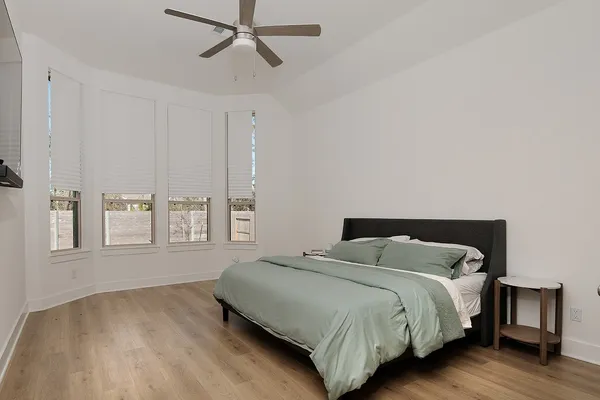 a bedroom with a bed and window
