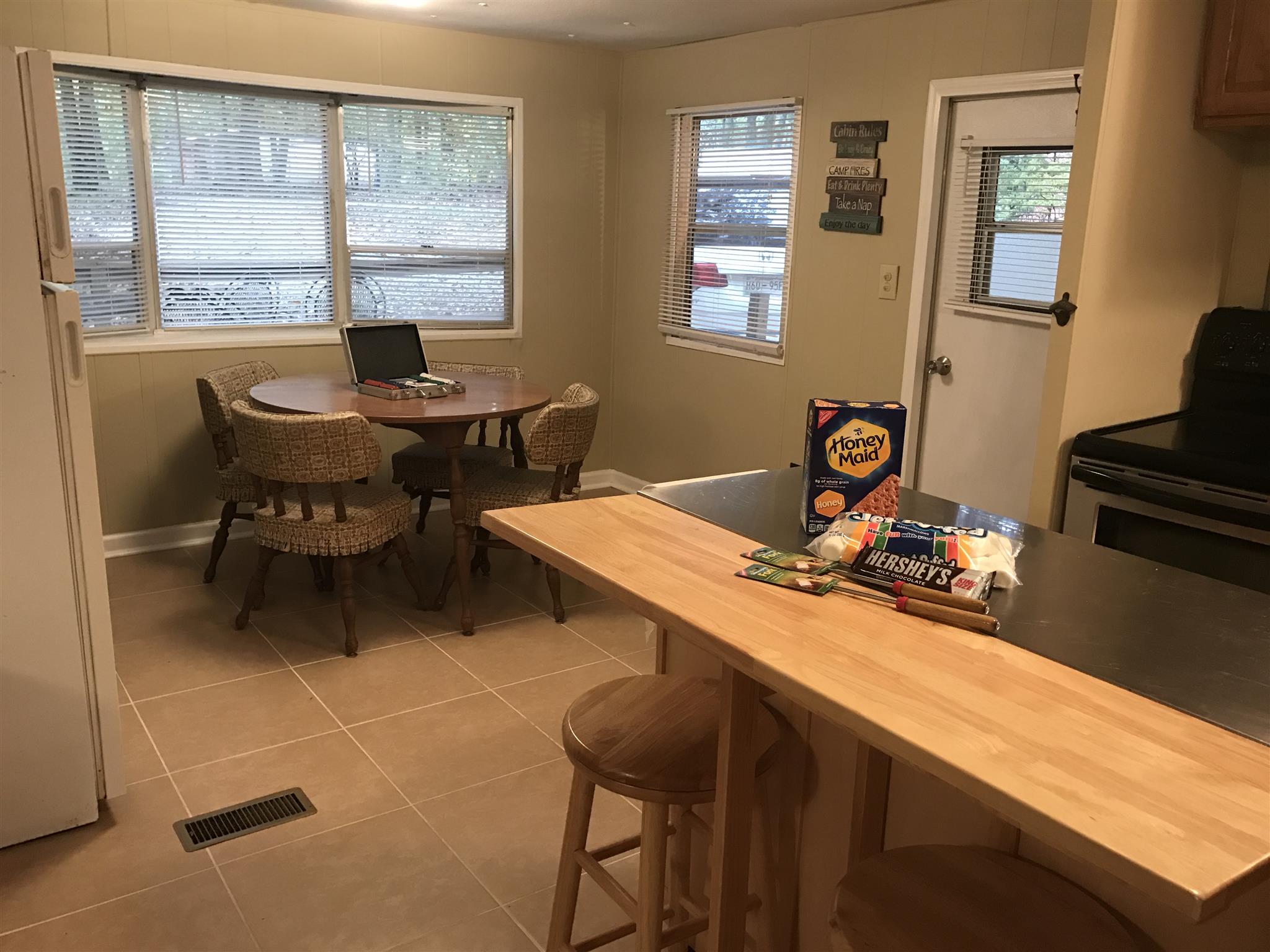 558 Ridgeway Drive Sugar Tree, TN 38380 - Photo 12 of 30 Large kitchen with eat in area and island with bar seating.