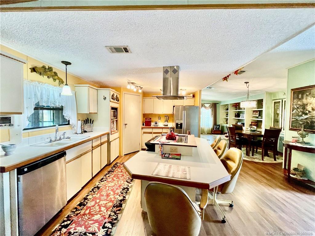 14623 Southwest Rake Drive Indiantown, FL 34956 - Photo 11 of 46 Smooth surface cooktop island. Newer dishwasher.