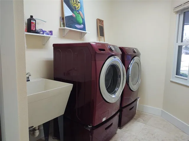 a utility room with dryer and washer