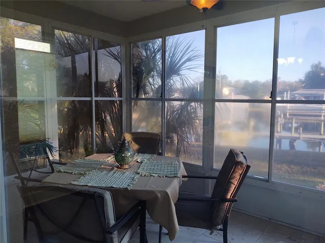 a dining room with table and chairs