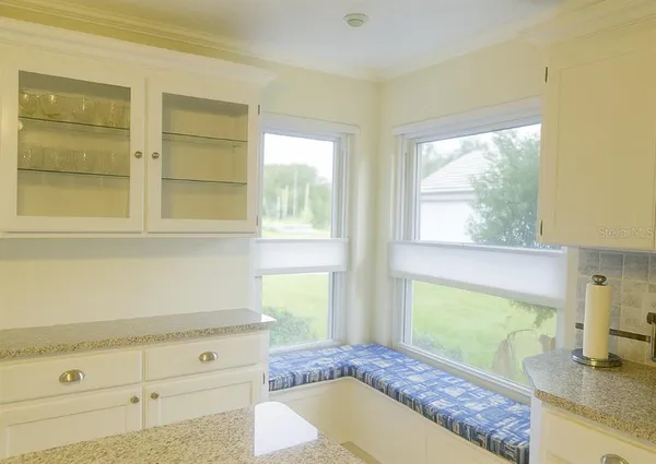 a bathroom with a granite countertop tub and a sink