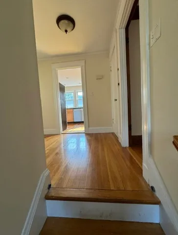a kitchen with a refrigerator and a stove