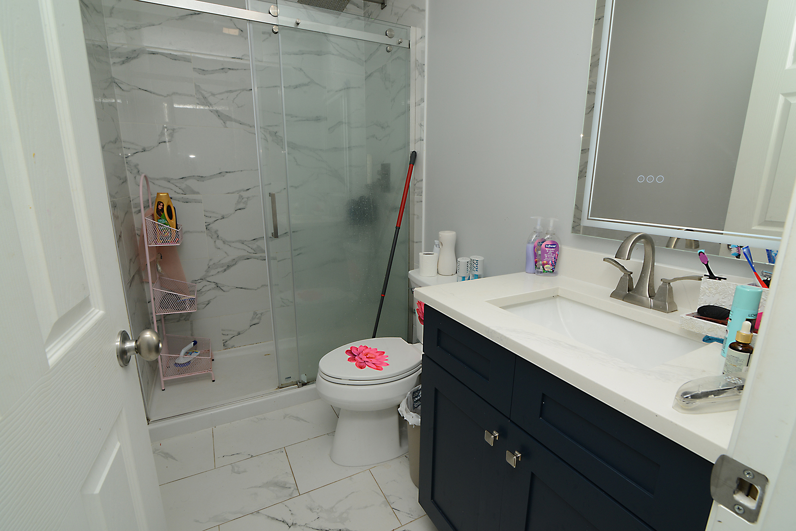1051 North Springfield Avenue Chicago, IL 60651 - Photo 38 of 50 a bathroom with a sink and a mirror